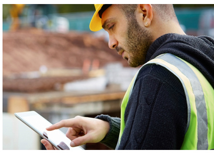 IFS field service apps construction worker using tablet