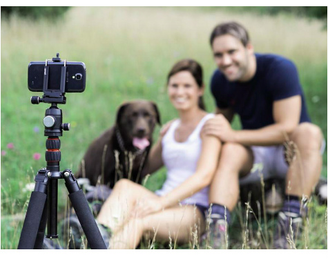 family posing with phone tripod
