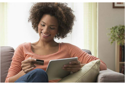woman shopping on tablet - mobile vs online shopping trends & online shopping habits