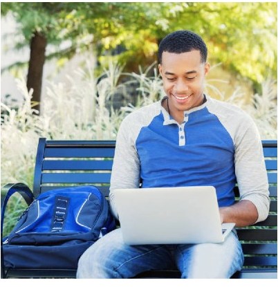 College business ideas: student with laptop on bench